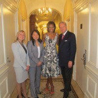 Missy Kostovny (Events Manager), Kin Han (Director of Diplomatic Sales) First Lady Michelle Obama and Eric Long (General Manager) in the Towers of the Waldorf Astoria Hotel